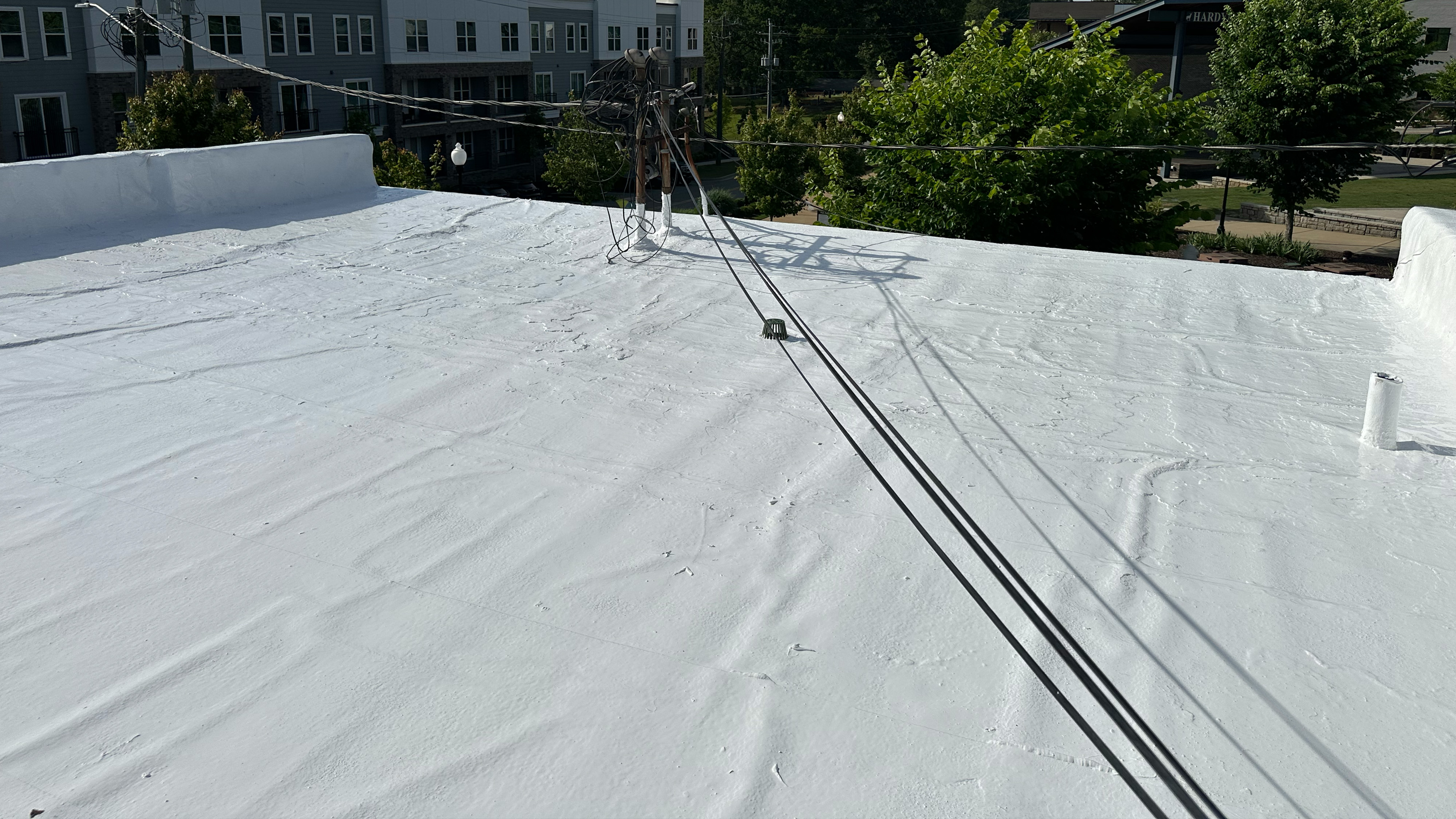 Silicone on asphalt roof